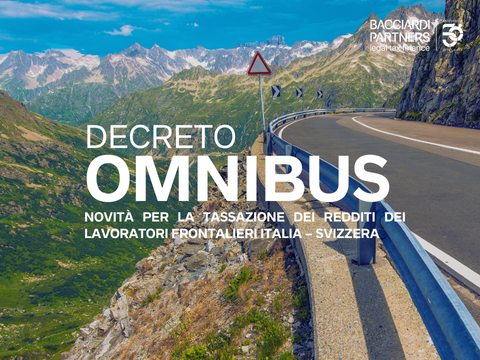mountain road with snow-capped peaks in the distance, bacciardi Partners logo and the text in graphics Omnibus Decree news for taxation of income of frontier workers italy switzerland